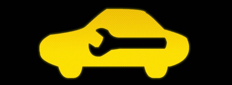 yellow warning light car with spanner